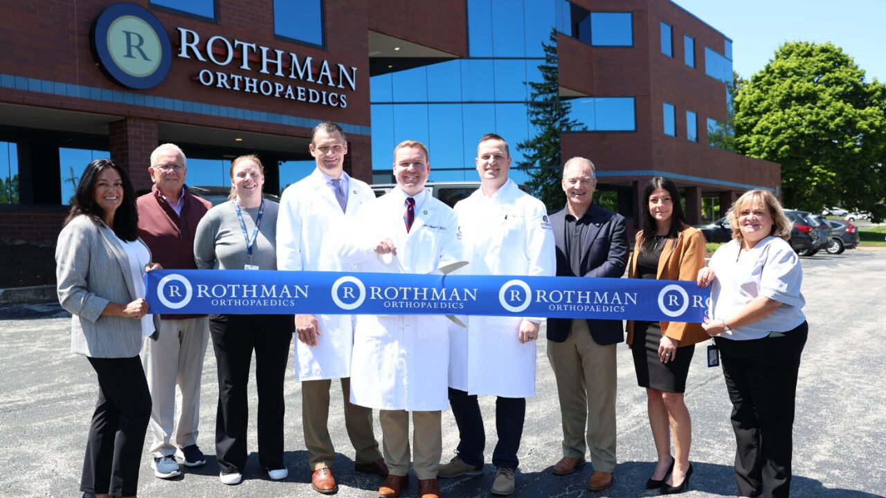 Rothman Orthopaedics Staff doing a ribbon cutting of the west chester, pennsylvania office.